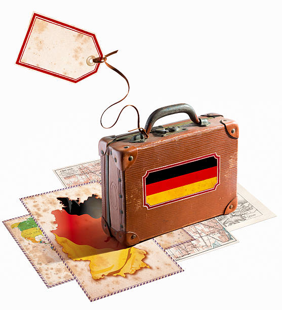 istock Antique leather suitcase with german flag on maps 481490147