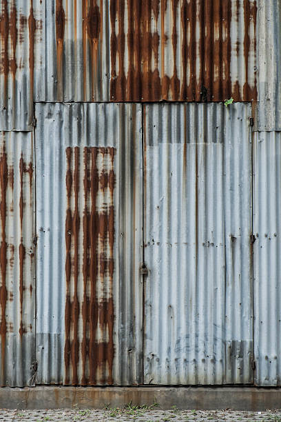 istock Old rusty zinc wall and door exterior 481491284