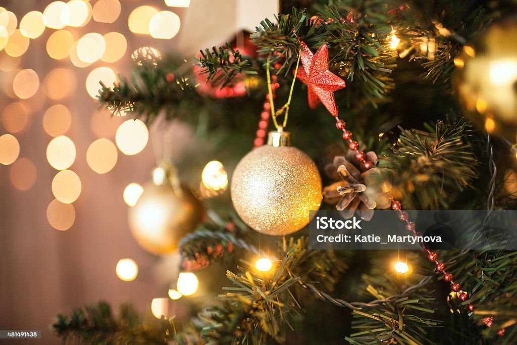 Beautiful holiday decorated room with Christmas tree Christmas Room Interior Design, Xmas Tree Decorated By Lights Presents Gifts Toys, Candles And Garland Lighting Indoors Christmas Tree Stock Photo