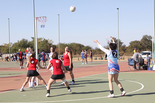 Rustenburg South Africa - June 6, 2015:  Korfball League games played at Olympia Park.  Ladies team:  Girl goal trowing ball at net.