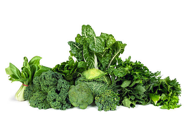 Leafy Green Vegetables Isolated Variety of leafy green vegetables isolated on white background. kale stock pictures, royalty-free photos & images