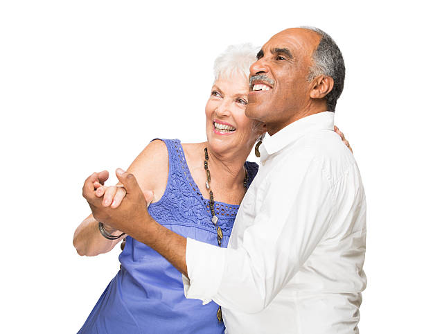 A Senior couple posing on studio white background
