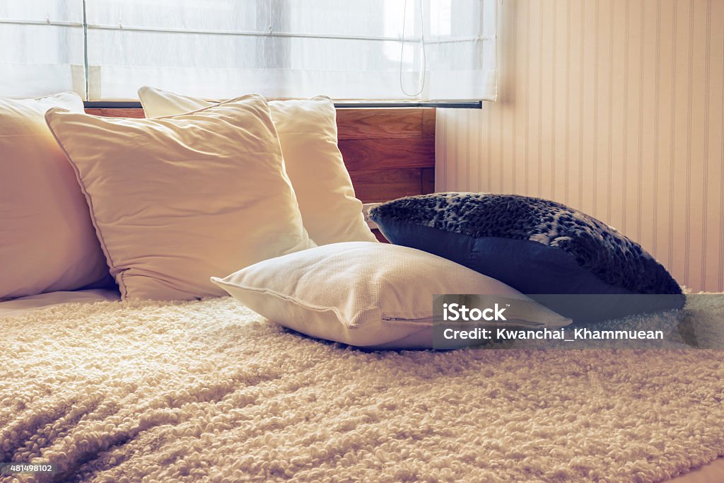 Vintage photo of stylish bedroom interior Vintage photo of stylish bedroom interior design with black and white pillows on bed. 2015 Stock Photo