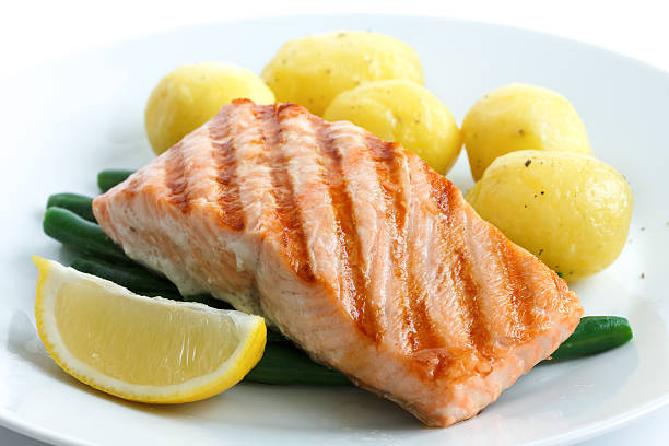 istock Juicy grilled salmon fillet with string beans and boiled potatoe 481498188