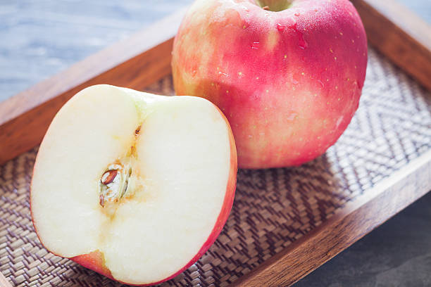 istock Red apple on wooden tray 481499212