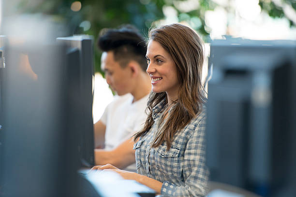 Adult Student Using Computer Hispanic Adult College Students Studying Together In Computer Lab Stock ...
