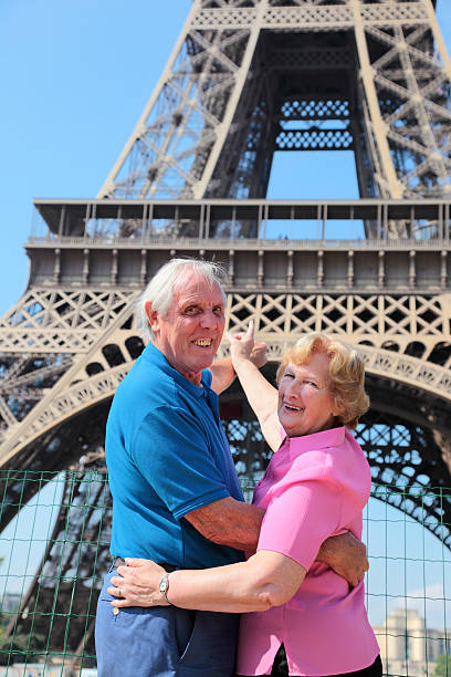 istock Senior couple in front of Eiffel Tower 481501317