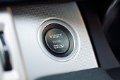 Car engine start and stop button on a hybrid car