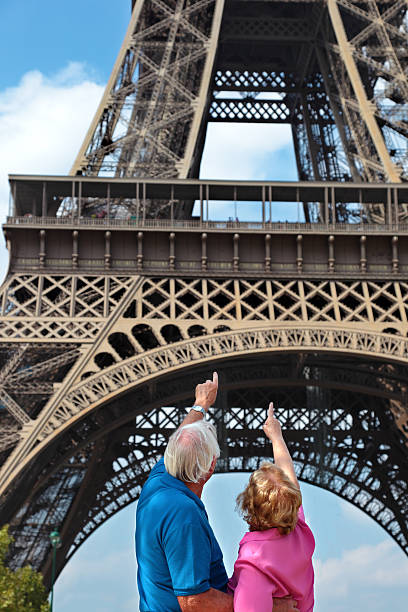 istock Senior couple in front of Eiffel Tower 481504163