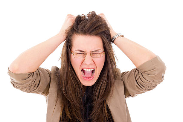 istock stressed woman pulling her hair in frustration 481506441