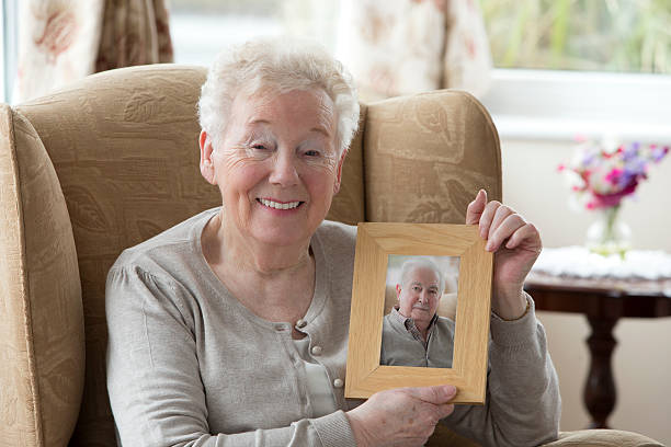 istock Senior Woman Holding A Photo Frame 481507879