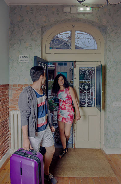 istock Young couple with suitcases arriving to a hostel 481507910