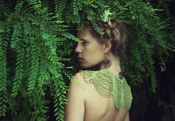 istock beautiful women in tropical leaves 481510011