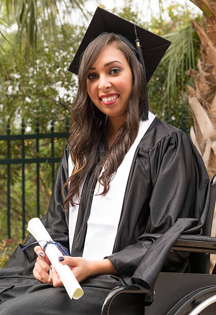 istock Young female graduate in wheelchair 481511355