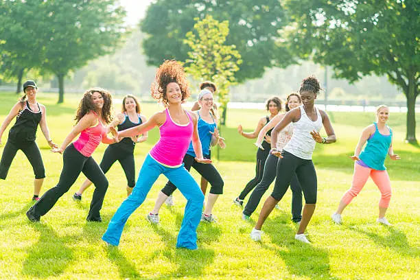 Diverse group of women dancing outdoor 