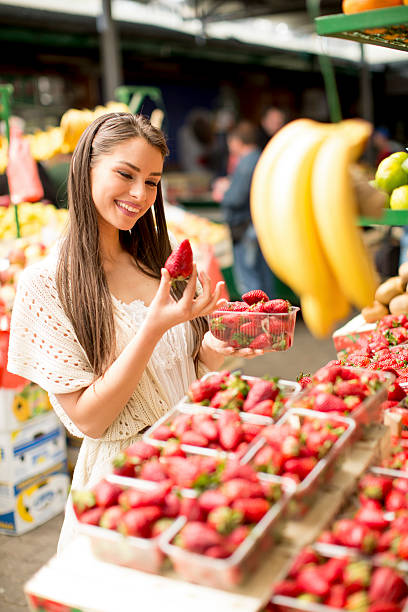 istock Young woman on the market 481512872