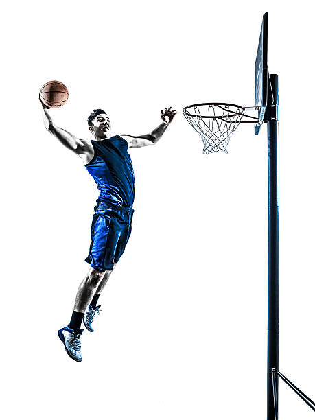 istock caucasian man basketball player jumping dunking silhouette 481512899