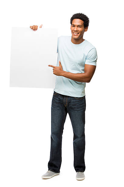 istock Casual young man holding up sign and pointing at it 481513175