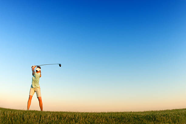 istock Young woman playing golf 481513261