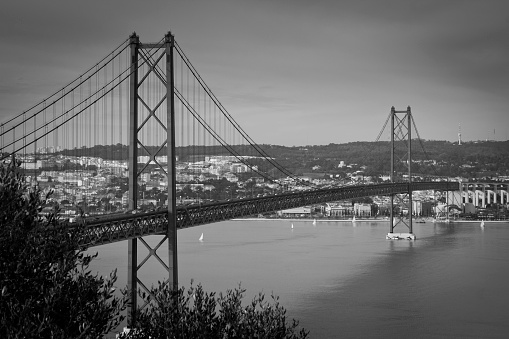 Photography made from the south bank of the Tagus' river (Tejo) where can be seen part of the Lisbon city and the 25th April' Bridge (Ponte 25 de Abril).