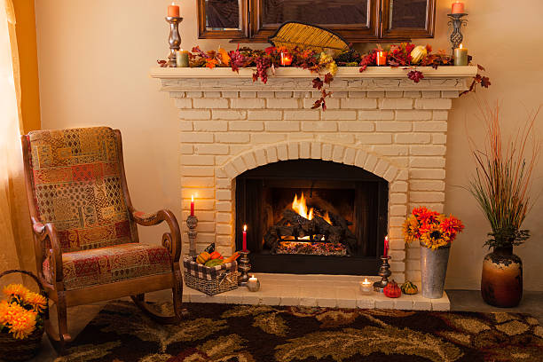 istock Old fashioned Thanksgiving fireplace and rocker in morning light 481519872