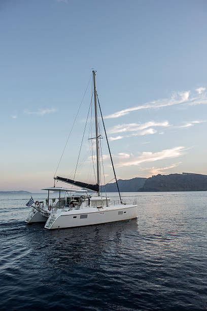Greek boat sailing the Aegean Sea at sunset - sail concepts