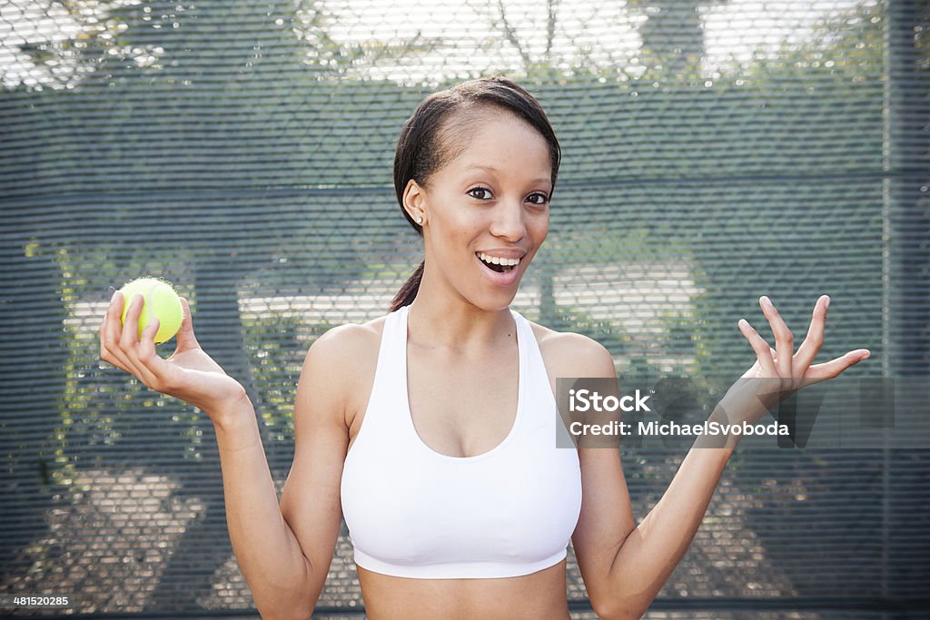 Happy Tennis Player A beautiful African American women at the tennis court. http://blog.michaelsvoboda.com/BreeTennis.JPG 20-29 Years Stock Photo