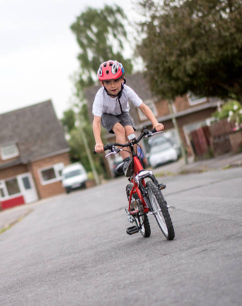 istock Happy boy riding a bike 481520320
