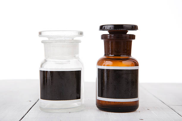 istock Vintage medicine bottles with blank labels on wooden table 481527242