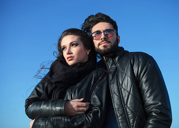 istock pensive young couple standing against blue sky 481527719