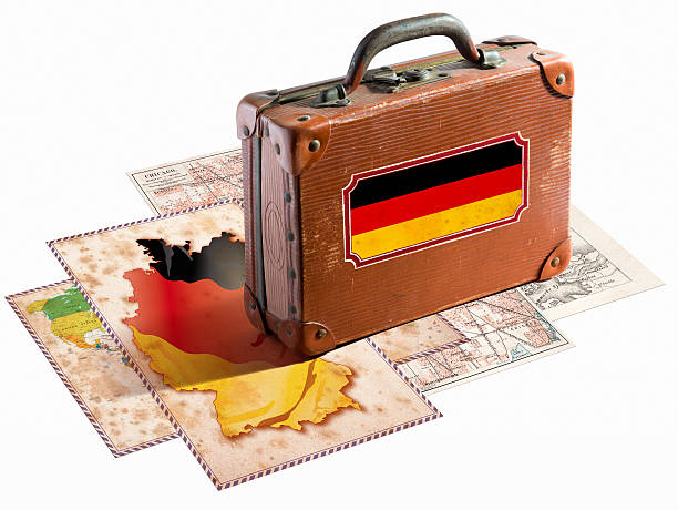 Antique leather suitcase with german flag on maps
