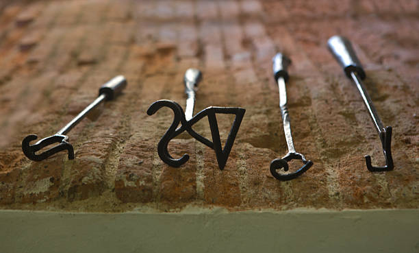 branding irons - brandmarken stock-fotos und bilder