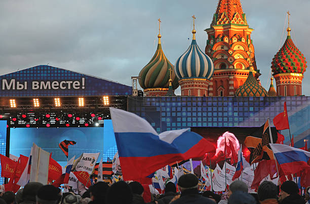More celebrations on Red Square Moscow, Russia, 18 March 2014: People at red square in Moscow celebrating news of Crimea reincorporation into Russia vladimir russia photos stock pictures, royalty-free photos & images