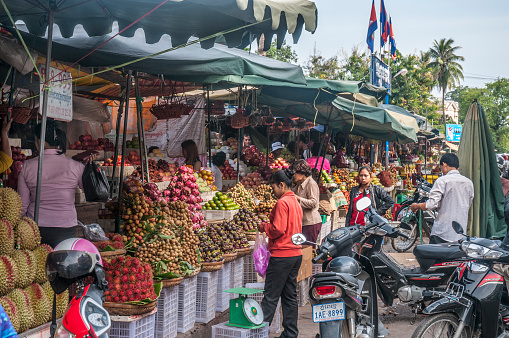 Phnom Penh, Cambodia - June 3, 2012: A busy scene of shoppers and market vendors in Kandal Market in the Cambodian Capital of Phnom Penh