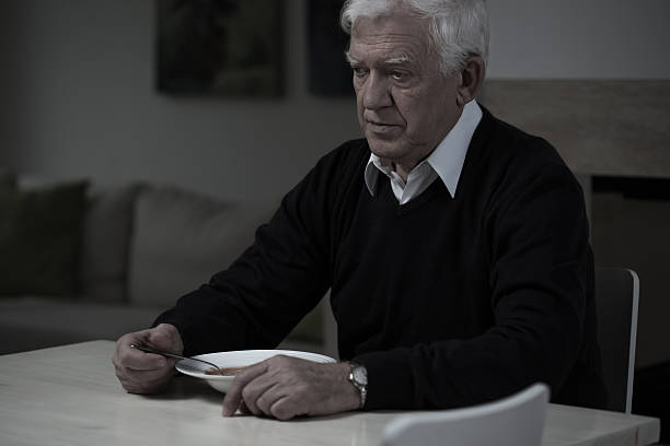 Picture of old, sad man without appetite