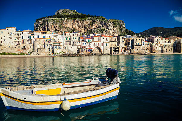 istock old boat drifting in a Cefalu harbor 481532474