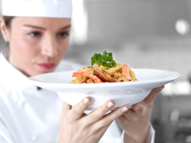 istock Chef looking at the delicious shrimp pasta 481537616