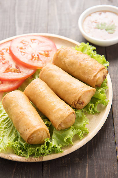 istock Fried Chinese traditional spring rolls on wooden background. 481539780