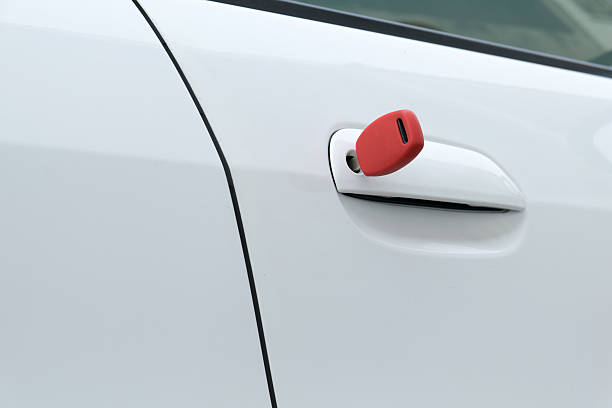 istock open car door with red key 481539830