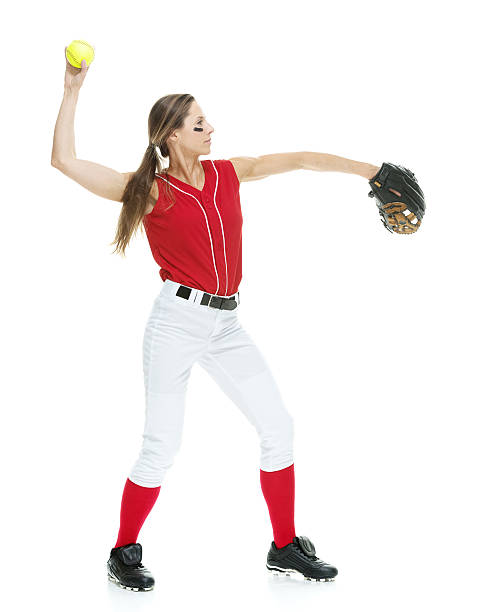 istock Female softball player throwing a ball 481541366