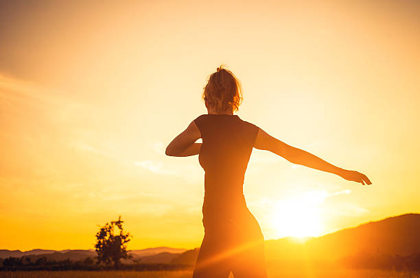 istock Young woman stretching in nature 481541678