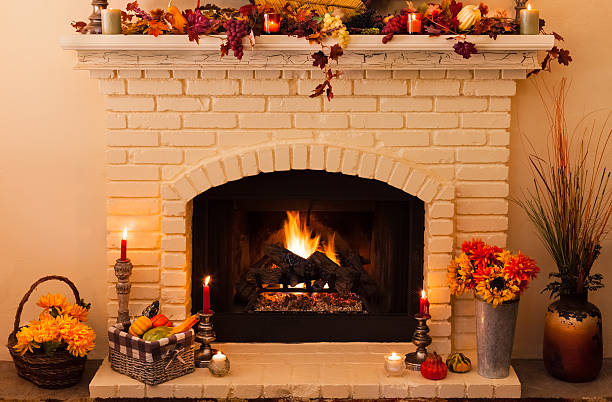 Old fashioned Thanksgiving fireplace with fire in morning light (P)