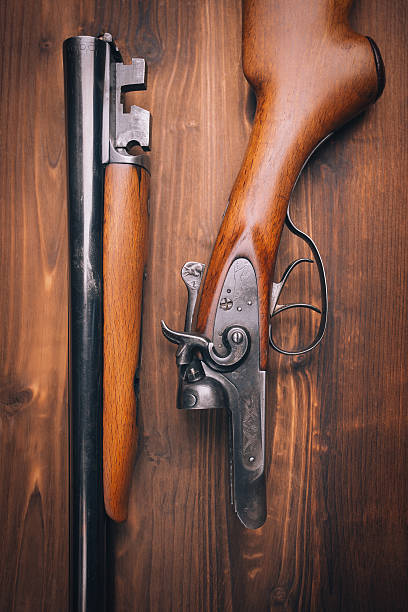 istock Shotgun on wooden background 481542823