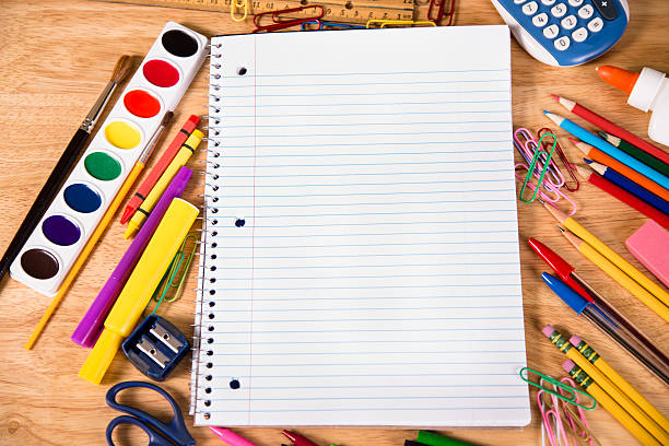 istock Back to school. Pile of school supplies with open notebook. 481543680