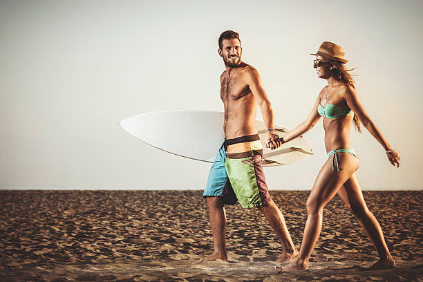 istock Happy couple walking at the beach 481543768