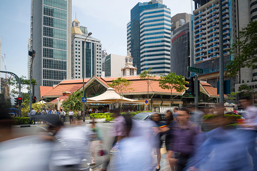 Singapore, Singapore - July 13, 2015: Office workers taking the pedestrian crossing going for lunch break at the Telok Ayer Market aka Lau Pa Sat. Telok Ayer Market aka Lau Pa Sat (\