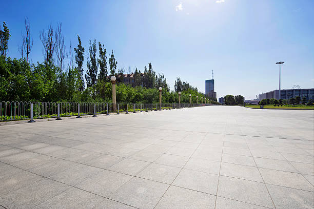 istock long empty footpath in modern city square with skyline. 481544130