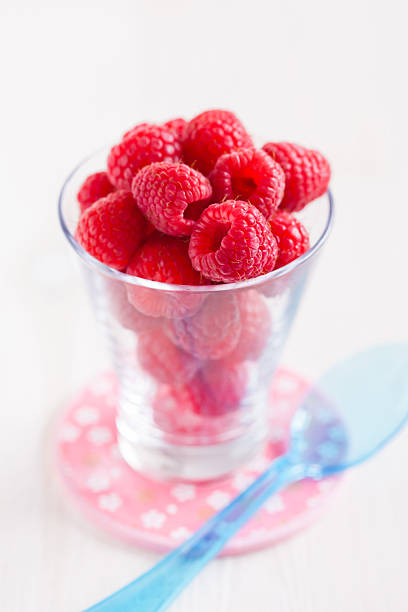 istock Fresh raspberries in glass 481544817