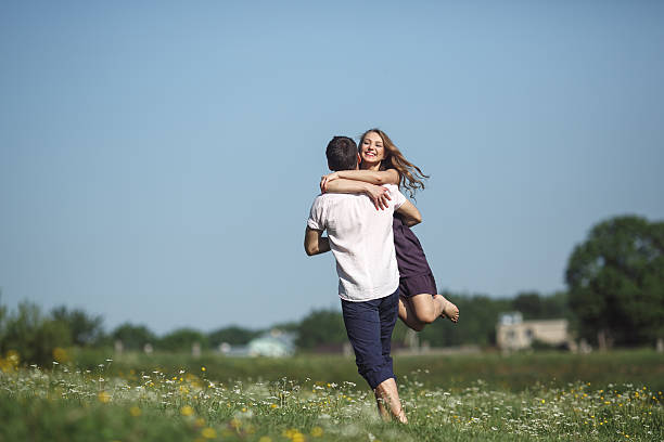 istock Couple running in field and have fun 481547492