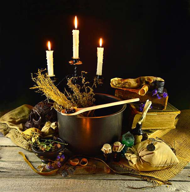 Witch cauldron Halloween still life with witch pot, burning candles and magic objects runes photos stock pictures, royalty-free photos & images